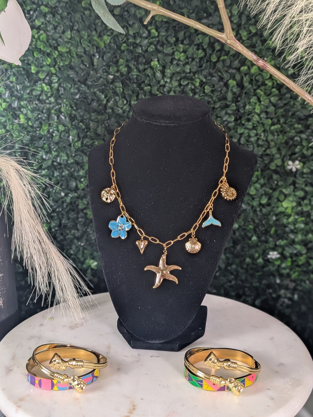 Gold Sea Charm Necklace with Blue Flower Accent